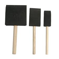 Three black foam sponges on wooden handles