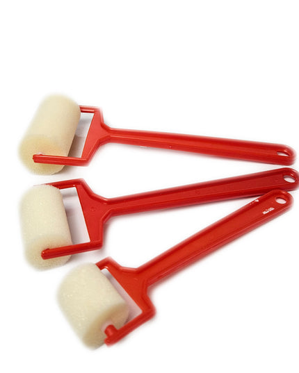 A set of three red sponge rollers