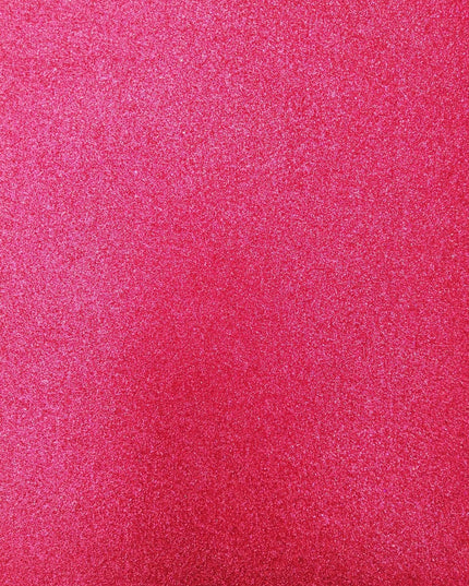 A close-up image of a red glitter-covered foam sheet.